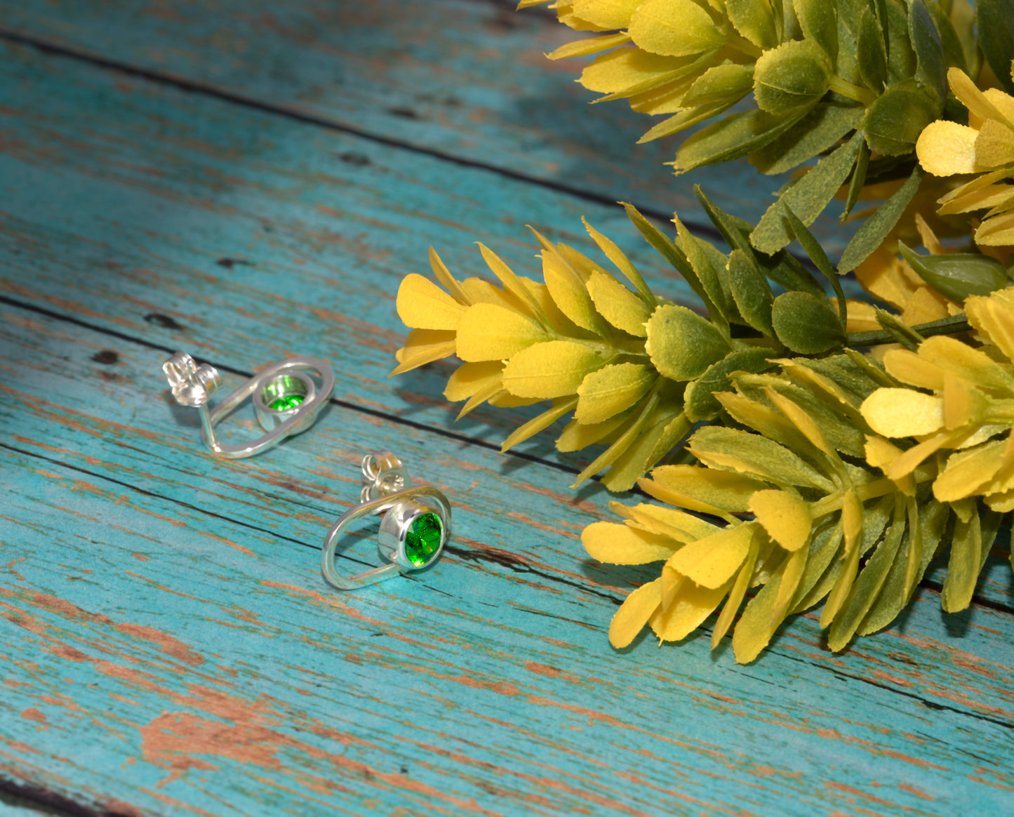 Sterling Silver Small Oval Earrings With Green Cubic Zirconia