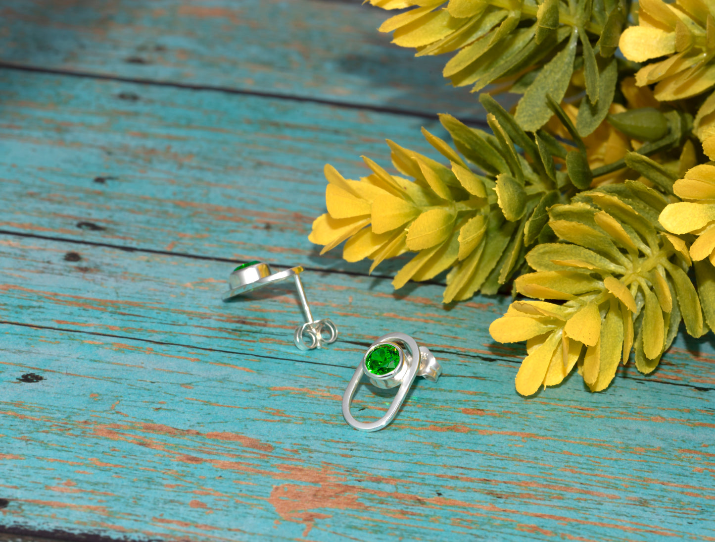 Sterling Silver Small Oval Earrings With Green Cubic Zirconia